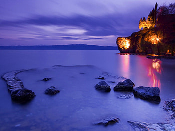 Before the dusk, sea, before, dusk, stones, purple, lights, clouds, sky, castle, water, ocean HD wallpaper