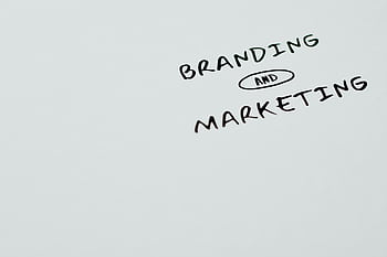A minimalist featuring the words 'Branding' and 'Marketing' on a white background, ideal for digital marketing themes. HD wallpaper