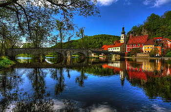 Countryside beauty, river, peaceful, houses, serenity, shore, reflection, bright, trees, water, tranquility, lighthouse, villas, country, lake, summer, mirrored, bridge, clouds, nature, sky, riverbank, clear, calmness, forest, village, countryside HD wallpaper
