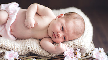Cute Baby Toddler Is Lying Down On Woolen Knitted White Cloth On Bamboo Basket Cute HD wallpaper