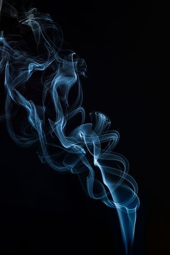 A captivating abstract of blue smoke swirling against a black backdrop, perfect for artistic concepts. HD phone wallpaper