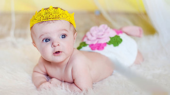 Beautiful Cute Baby Toddler Is Lying Down On White Bed In Blur Background Cute HD wallpaper