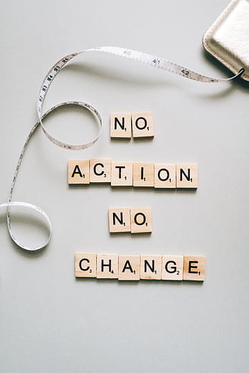 Scrabble tiles form motivational message ‘No Action No Change’ with a measuring tape. HD phone wallpaper