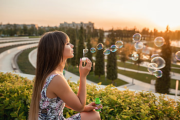 Girl Blowing Bubbles Outdoors, girls, bubbles, outdoors HD wallpaper