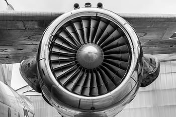 Detailed view of a jet engine in monochrome, showcasing aviation technology. HD wallpaper