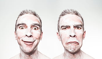 A whimsical portrait showing dual expressions of a man with a painted face. HD wallpaper