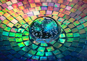 Colorful mosaic pattern with a glass bubble sphere reflecting vibrant rainbow colors. HD wallpaper