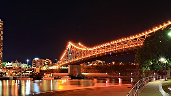 river walk under a bridge at night, night, river, city, lights, path, bridge HD wallpaper