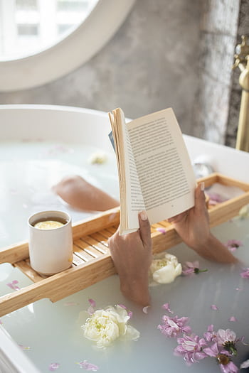 A peaceful bath scene with flowers, a book, and coffee, evoking tranquility and relaxation. HD phone wallpaper