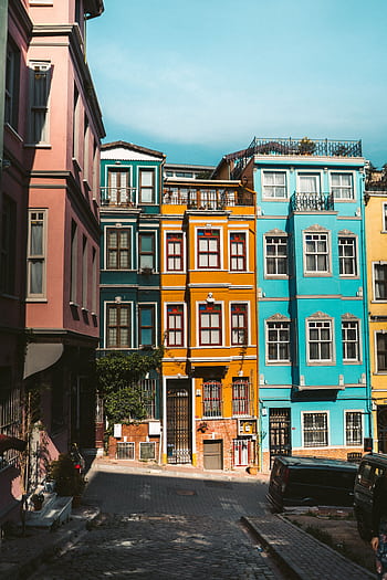 Colorful historic buildings in Balat, Istanbul, showcasing vibrant urban architecture. HD phone wallpaper