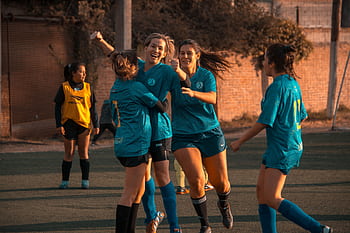 Women's soccer team celebrates a win during a game in Córdoba, Argentina. HD wallpaper