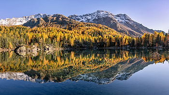Green Yellow Orange Autumn Trees Snow Covered Mountains Slope Under Blue Sky Reflection On Lake Nature HD wallpaper
