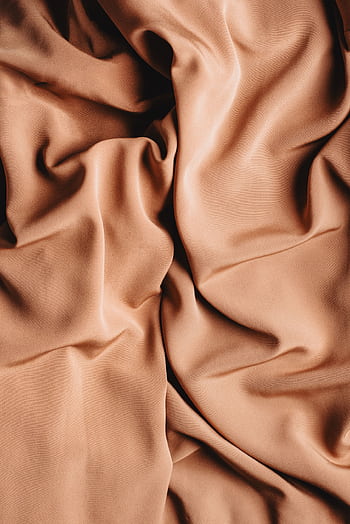 Full frame shot of warm beige fabric with soft folds and smooth texture, ideal for backgrounds. HD phone wallpaper