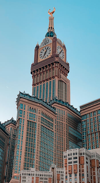 Stunning view of the iconic Abraj Al-Bait Clock Tower in Mecca, Saudi Arabia. HD phone wallpaper