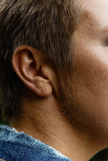 Detailed side profile showcasing a man's ear and short hair. HD phone wallpaper