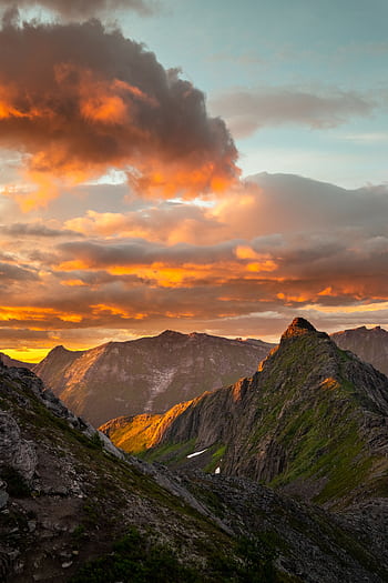 Breathtaking view of Segla Mountain with vibrant sunset skies in Northern Norway. HD phone wallpaper