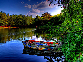 Boat in mirrored waters, river, boat, peaceful, lonely, lake, summer, reflection, clouds, trees, nature, waters, sky, calm, pond HD wallpaper