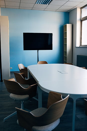 A contemporary conference room featuring sleek design and abundant natural light. HD phone wallpaper