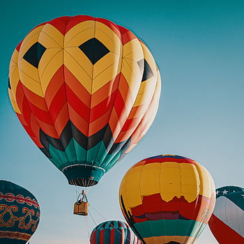 Vibrant hot air balloons soaring in the sky, offering a stunning view. HD phone wallpaper
