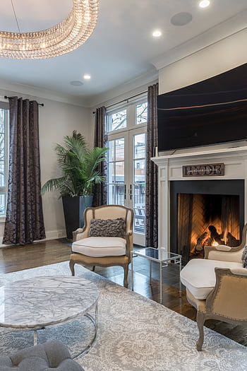 Cozy and stylish living room interior featuring a fireplace and modern decor. HD phone wallpaper