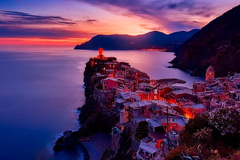 Discover the serene beauty of Vernazza during a mesmerizing sunset along Italy's Cinque Terre coast. HD wallpaper