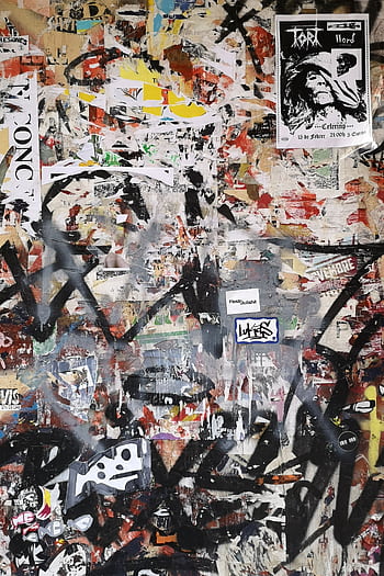 Vibrant urban graffiti collage on a wall, showcasing diverse expressive art styles and textures. HD phone wallpaper
