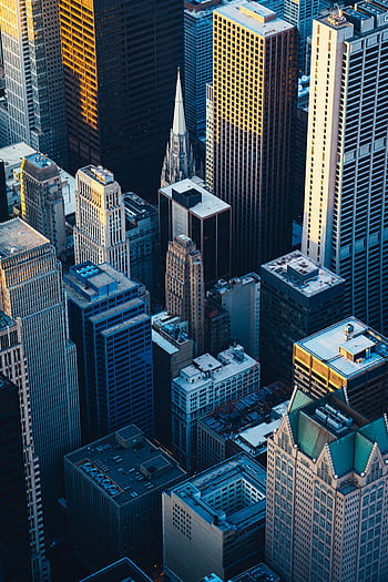 Dramatic aerial view of Chicago's iconic skyscrapers at twilight, showcasing urban architecture. HD phone wallpaper