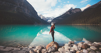 Girl Standing Over Rock , girl, rock, mountains, snow HD wallpaper