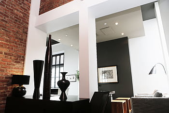 Sleek and modern loft with contemporary interior decor, featuring exposed brick and elegant accents. HD wallpaper