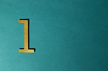 A gold number one on a teal background with ample copy space. HD wallpaper