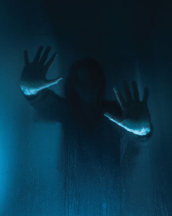 Mysterious silhouette with hands on foggy glass, evoking eerie and suspenseful vibes. HD phone wallpaper