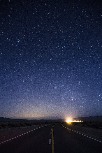 A scenic road leading into a starry night sky in San Juan, Argentina. HD phone wallpaper