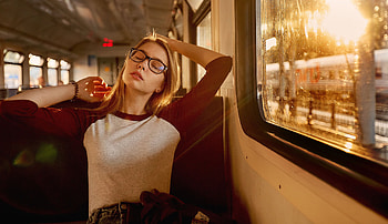 Women With Glasses Closed Eyes Sitting In Train, girls, glasses, model, train, graphy, depth-of-field, outdoors HD wallpaper