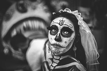 A dramatic black and white portrait of a woman in Day of the Dead makeup wearing a veil. HD wallpaper