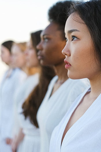A diverse group of women in profile, symbolizing unity and strength. HD phone wallpaper