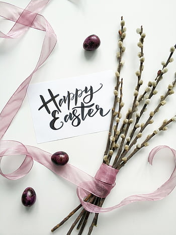 Flat lay of an Easter card with pussy willow branches and pink ribbon on a white background. HD phone wallpaper