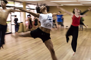 Dynamic group dance class showcasing diverse techniques and spirited expressions. HD wallpaper