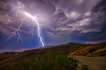 A breathtaking lightning strike during a thunderstorm over the Wenatchee hills, capturing the power of nature. HD wallpaper