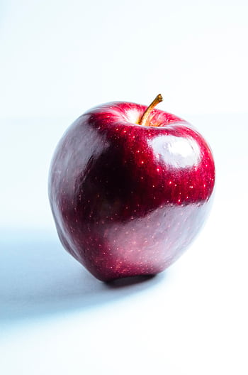 High-quality of a fresh, shiny red apple with a white background. HD phone wallpaper