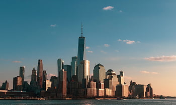 Stunning view of New York City skyline during sunset, highlighting iconic skyscrapers. HD wallpaper