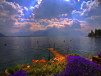 Clouds over the sea, coast, peaceful, dusk, beach, shore, reflection, water, calm, ocean, sea, beautiful, dark, clouds, nature, sky, flowers, storm HD wallpaper