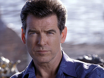 Pierce Brosnan, Dashing spy, Captivating backgrounds, Iconic HD wallpaper