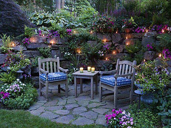 Evening, table, plants, garden, green trees, rocks, chairs, colorful leaves, lights, beautiful views, colorful flowers, candles HD wallpaper