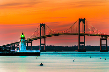 Sunset over lighthouse, Newport Rhode Island, Bridge in backdrop, Serene scenery HD wallpaper