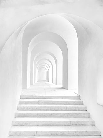 A minimalist white arched hallway in Prague with repetitive symmetry and soft lighting. HD phone wallpaper