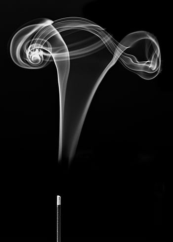 Black and white of swirling incense stick smoke creating an artistic pattern. HD phone wallpaper