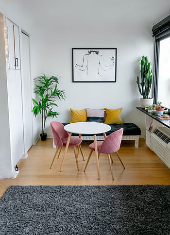Contemporary living room featuring stylish furniture, artwork, and lush greenery. HD phone wallpaper