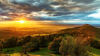 Beautiful Sunset, dawn, hills, sunrays, trees, clouds, landscape, sky, castle HD wallpaper