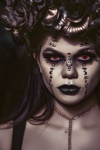 Striking portrait of a women in gothic makeup and floral headpiece, exuding mysterious elegance. HD phone wallpaper
