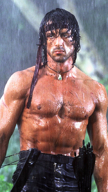 Rambo: First Blood Part II, Intense war scenes, Sylvester Stallone in action, Iconic character HD phone wallpaper